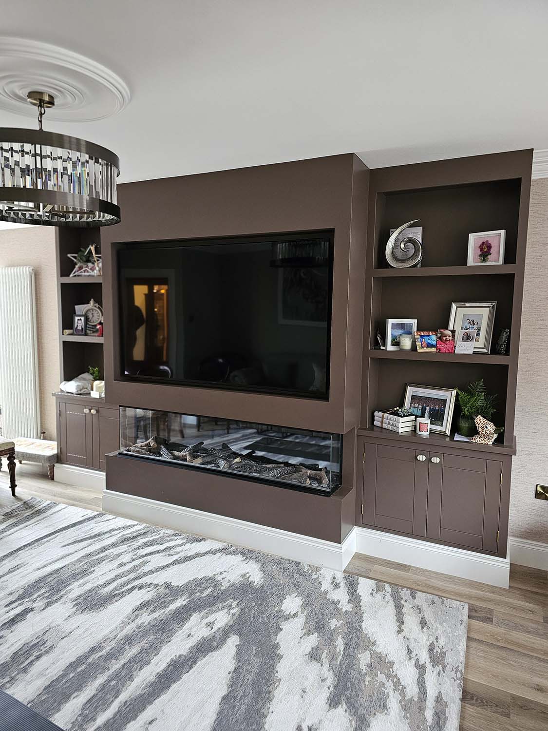 Full width media wall with fire and cupboards