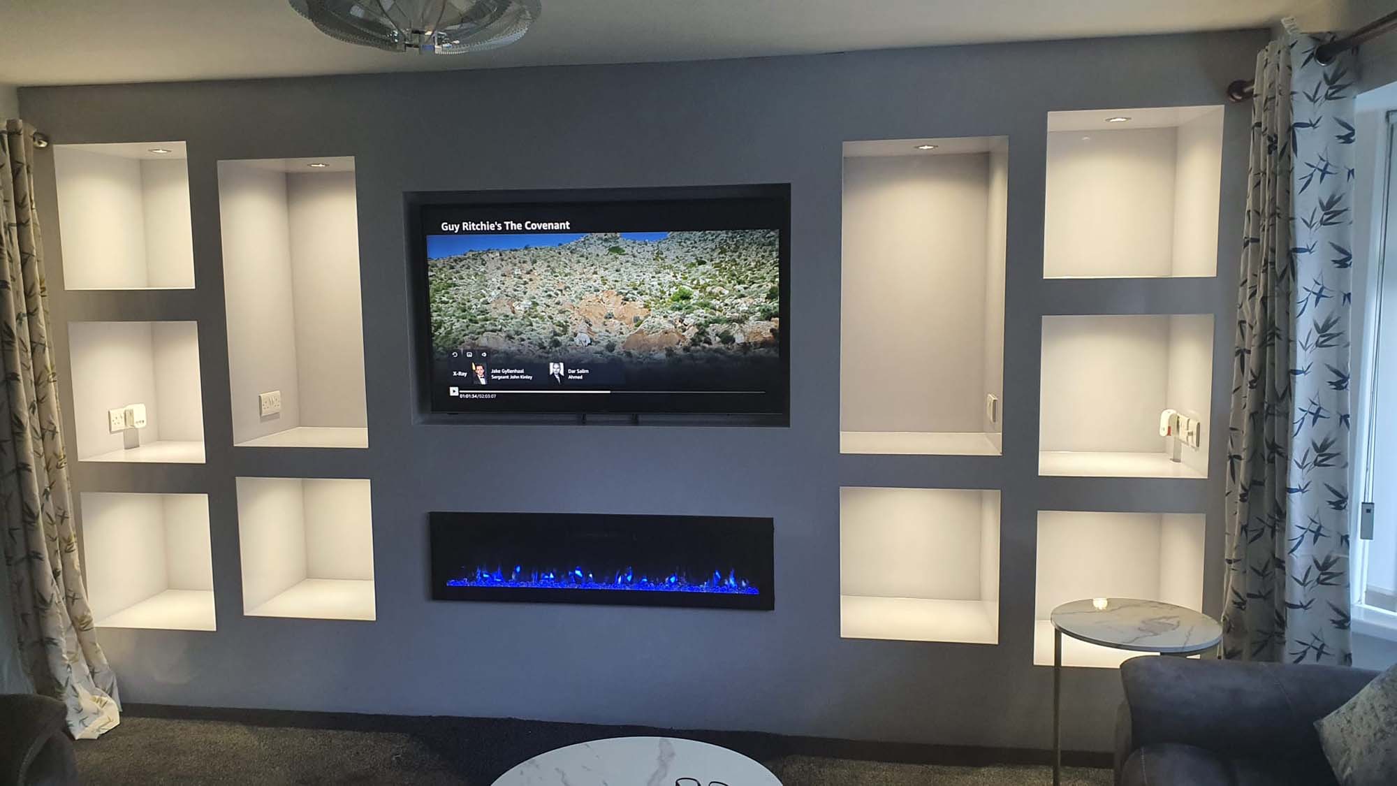 Full width media wall with fire